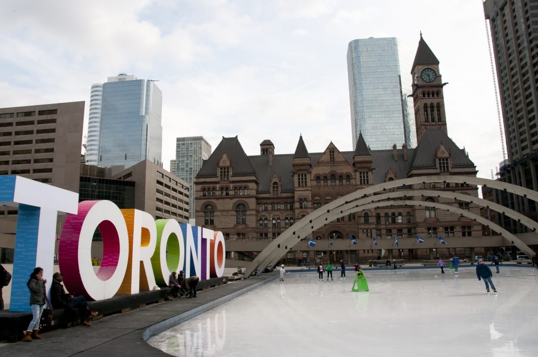 Ice skating rink next to Toronto sign